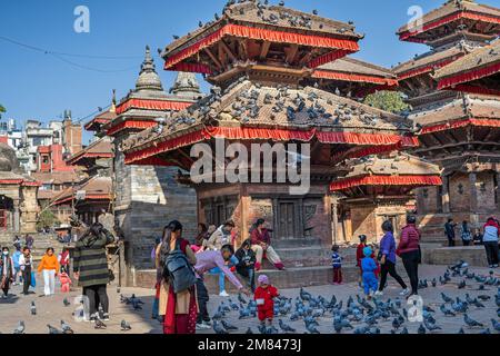 Kathmandu, Nepal - December 5th, 2022 - People visiting Durbar Square, a complex of temples and open courts. UNESCO World Heritage Site. Stock Photo