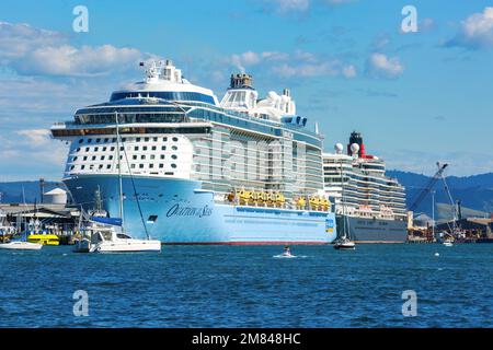 Two cruise ships, the Royal Caribbean liner 'Ovation of the Seas' and the Cunard 'Queen Elizabeth' in port. Mount Maunganui, New Zealand Stock Photo