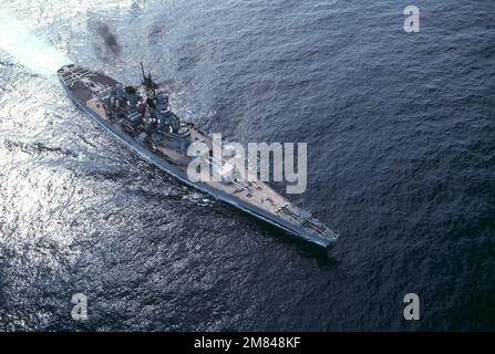 An elevated starboard bow view of the battleship USS IOWA (BB 61) underway off the coast of Virginia. Country: Atlantic Ocean (AOC) Stock Photo