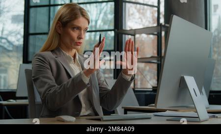 Caucasian adult middle-aged business coach entrepreneur tutor mentor advisor woman communicate by video call. Mature businesswoman speaking looking at Stock Photo