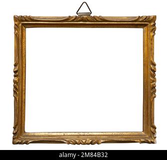 Antique golden frame isolated on white background. Old wooden frame with floral carvings painted with gold paint. Italian heritage and antiquities Stock Photo