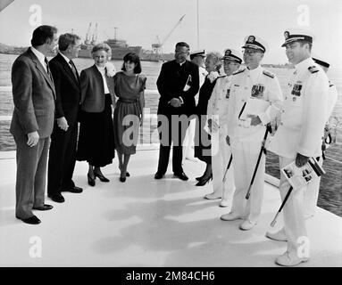 Members of the christening party attending the ceremony for the Aegis guided missile cruiser MOBILE BAY (CG-53) are (L-R): Mr. J. St. Pe'; Sen. J. Denton Jr., R-Ala., Miss E. Denton, maid of honor; Archbishop O. Lipscomb; Rear Adm. W. Meyer, deputy commander, Combat Systems, Naval Sea Systems Command; Mrs. M. McPhillips, matron of honor; Vice Adm. J. Metcalf III, deputy chief of Naval Operations, Surface Warfare; Commodore J. Shaw, program manager, Aegis Shipbuilding, Naval Sea Systems Command; and Capt. F. Whalen, prospective commanding officer of the MOBILE BAY. Base: Pascagoula State: Missi Stock Photo