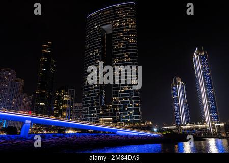 Dubai marina skyscrapers during night hours. Beautiful night view of skyscrapers in Dubai Marina. Stock Photo