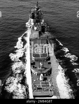 An elevated stern view of the guided missile cruiser USS VALLEY FORGE (CG-50) underway. Country: Unknown Stock Photo