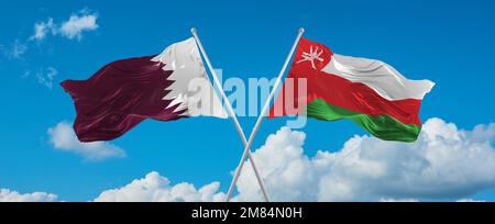 two crossed flags Qatar and Oman waving in wind at cloudy sky. Concept ...
