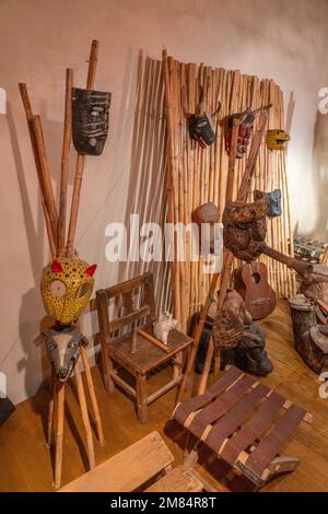 Masks and musical instruments from various eras in Oaxaca In the Museum of Oaxacan Cultures in Oaxaca, Mexico. Stock Photo