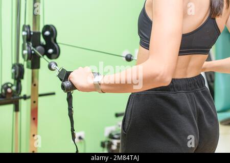 Arm and shoulder exercise machine in the gym Stock Photo - Alamy