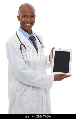 A blank tablet screen reserved for copy space. A handsome african doctor holding a digital tablet and smiling at the camera. Stock Photo