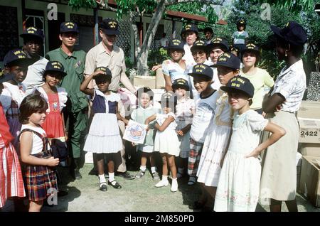 Chaplain (LT.) Thomas Murphy from the battleship USS IOWA (BB-61) presents Project Handclasp materials to the staff and children of Hogar Christiano Girl's Orphanage. Father Murphy is supervisiing the civic action work performed by off duty crew members during a scheduledport visit. Base: Puerto Caldera Country: Costa Rica (CRI) Stock Photo