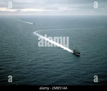 An aerial starboard bow view of two Pegasus class patrol combatant-missile (hydrofoils) underway during high-speed maneuvers. Country: Gulf Of Mexico Stock Photo