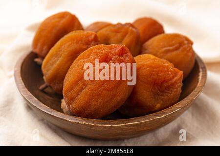 Half-dried persimmon made by drying persimmons Stock Photo