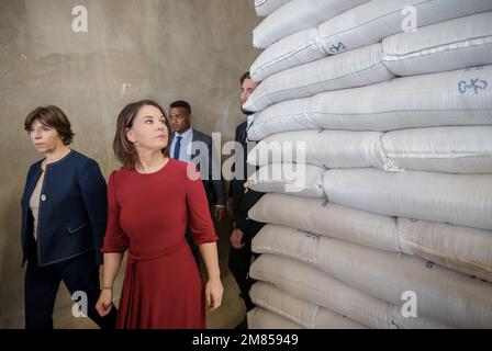 Adama, Ethiopia. 12th Jan, 2023. Annalena Baerbock (Bündnis90/Die Grünen), foreign minister, visits a grain warehouse of the United Nations World Food Program (WFP) next to the country director of Ethiopia Claude Jibidar. Baerbock, along with French Foreign Minister Catherine Colonna (l), plans to hold talks with the Ethiopian government and the African Union (AU) regional organization. The Ethiopian government had reached a peace agreement with the Tigray People's Liberation Front (TPLF) in November. Credit: Michael Kappeler/dpa/Alamy Live News Stock Photo