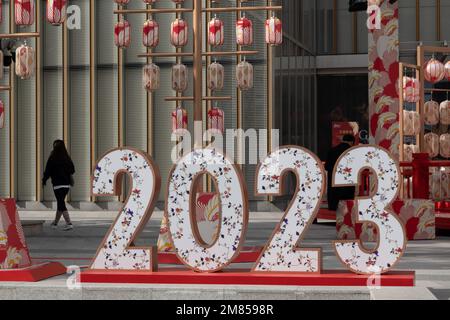 SHANGHAI, CHINA - JANUARY 12, 2023 - Pedestrians walk past the LOGO of 2023 on Xujiahui Street in Shanghai, China, January 12, 2023. Stock Photo