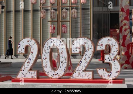 SHANGHAI, CHINA - JANUARY 12, 2023 - Pedestrians walk past the LOGO of 2023 on Xujiahui Street in Shanghai, China, January 12, 2023. Stock Photo