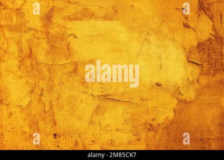 Grunge yellow painted damaged wall texture background. Stock Photo