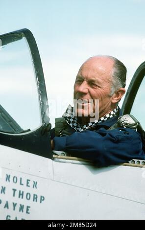 Retired Brig. GEN. Charles E. Yeager sits in the cockpit of a P-51 Mustang aircraft parked on the flight line during an air show held for the Air Force Association's 'Gathering of Eagles,' a convention commemorating spectacular achievements in the free world's aerospace development. Base: Indian Springs Auxiliary Field State: Nevada (NV) Country: United States Of America (USA) Stock Photo