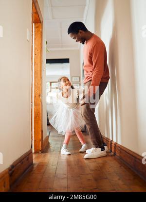 Dance, happy and ballet with father and daughter learning, support and weekend bonding. Princess, teaching and music with dad and girl in black family Stock Photo