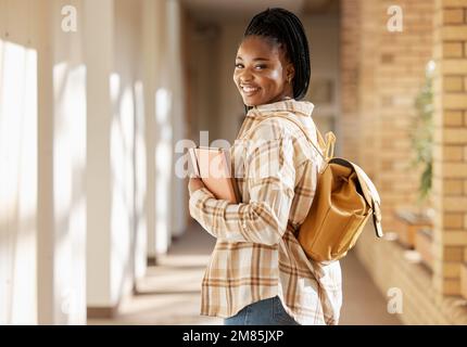College student portrait, black woman and university with books and backpack while walking at campus. Young gen z female happy about education Stock Photo