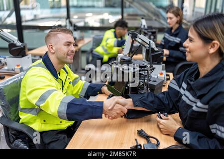 Engineer learn basic theory how to operation maintenance and programing robot arm in training room Stock Photo