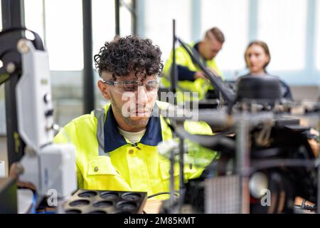 Engineer learn basic theory how to operation maintenance and programing robot arm in training room Stock Photo