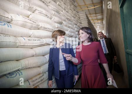 Adama, Ethiopia. 12th Jan, 2023. German Foreign Minister Annalena Baerbock (right) visits a World Food Program grain warehouse in Ethiopia with her French counterpart Catherine Colonna. Credit: Michael Kappeler/dpa/Alamy Live News Stock Photo