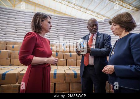 Adama, Ethiopia. 12th Jan, 2023. Annalena Baerbock (l, Bündnis90/Die Grünen), Foreign Minister, visits a grain warehouse of the United Nations World Food Program (WFP) together with French Foreign Minister Catherine Colonna next to the Country Director of Ethiopia Claude Jibidar. Baerbock, along with French Foreign Minister Colonna, plans to hold talks with the Ethiopian government and the African Union (AU) regional organization. The Ethiopian government had reached a peace agreement with the Tigray People's Liberation Front (TPLF) in November. Credit: Michael Kappeler/dpa/Alamy Live News Stock Photo