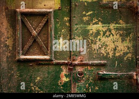 rusty door lock with deadbolt, on weathered wooden door, Valletta, Malta, Europe Stock Photo