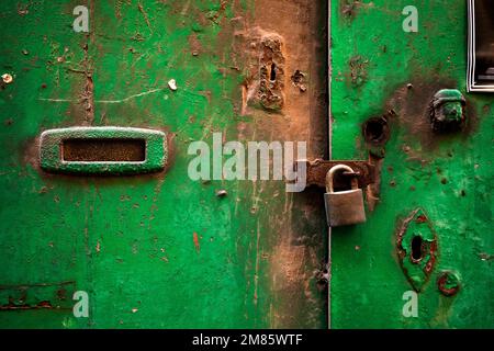 rusty door lock with deadbolt, on weathered wooden door, Valletta, Malta, Europe Stock Photo