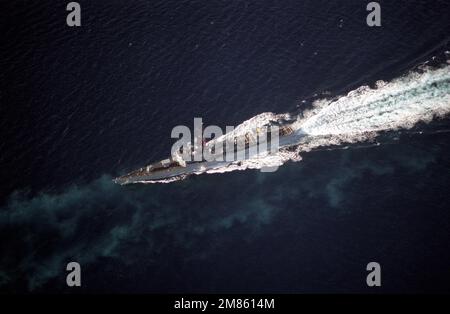 An aerial port bow view of the guided missile frigate USS RAMSEY (FFG-2) underway. Country: Unknown Stock Photo