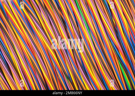 Close-up of multi-colored narrow gauge electrical wire wrapped round former (mage centre reasonably flattened). For colour identification crossed wire Stock Photo