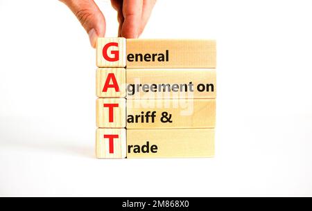 GATT symbol. Concept words GATT general agreement on tariff and trade on wooden block on beautiful white background. Business GATT general agreement o Stock Photo