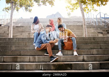 Relax, phone or students on steps at lunch break talking or speaking of future goals or education on campus. Social media, school or happy friends in Stock Photo
