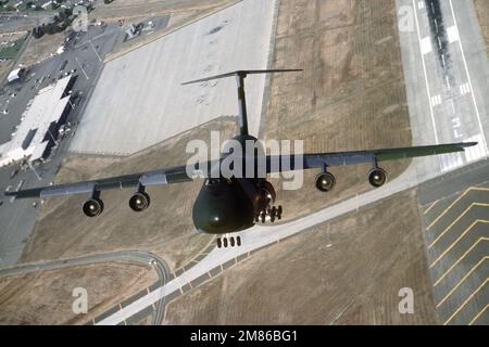 Air to air side view of Air Mobility Command's 62nd Airlift Wing, McChord  AFB, Washington C-130 Hercules and C-141 Starlifter flying with Mt. Ranier  in the background. Exact Date Shot Unknown - NARA & DVIDS Public Domain  Archive Public Domain Search