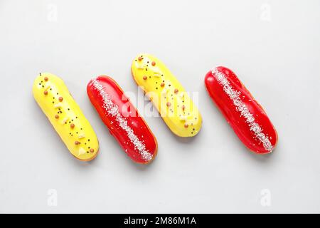 Delicious glazed eclairs isolated on white background Stock Photo