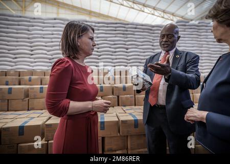 Adama, Ethiopia. 12th Jan, 2023. Annalena Baerbock (Bündnis90/Die Grünen), foreign minister, visits a grain warehouse of the United Nations World Food Program (WFP) next to the country director of Ethiopia Claude Jibidar. Baerbock, along with French Foreign Minister Catherine Colonna (r), plans to hold talks with the Ethiopian government and the African Union (AU) regional organization. The Ethiopian government had reached a peace agreement with the Tigray People's Liberation Front (TPLF) in November. Credit: Michael Kappeler/dpa/Alamy Live News Stock Photo