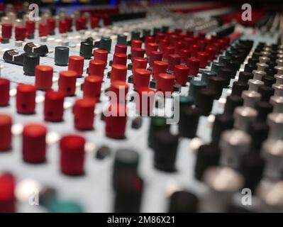 Audio recording mixing console with fader and knobs. Stock Photo
