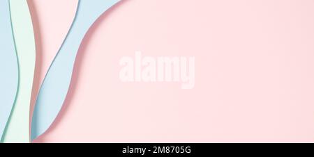 Abstract colored paper texture background. Minimal paper cut composition with layers of geometric shapes and lines in pastel green, pink and light Stock Photo