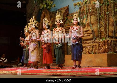 SIEM REAP, CAMBODIA - FEB 14, 2015 - Line of apsara dancers perform at a recital, Siem Reap, Cambodia Stock Photo