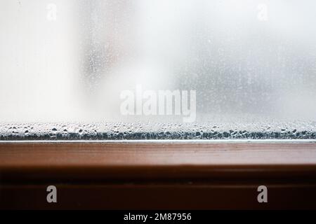 Failed brown window glazing with condensation inside. Stock Photo