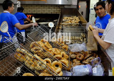 Bakers making Montreal styled bagels in St Viateur Bagel shop.Mile End.Montreal.Quebec;Canada Stock Photo