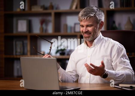 Purposeful young business woman, professional entrepreneur, reads a book. Business woman in a beautiful office in cinematic light. A beautiful Stock Photo