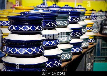Beautiful colorful Asian decorated white blue art ceramic handmade pottery jars vessels cups mugs Stock Photo