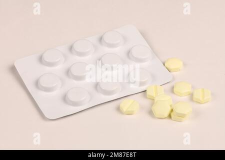 Hexagonal pills on light pink background. Extreme closeup. High ...