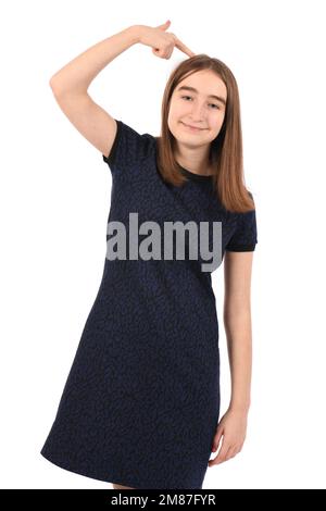 Young beautiful girl in a dark blue dress on a white background, confuse and wonder about question. Uncertain with doubt, thinking with hand on head. Stock Photo