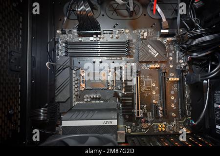 Intel computer motherboard in case without components added, CPU socket on visible, MSI PRO Z690-A DDR4 Stock Photo