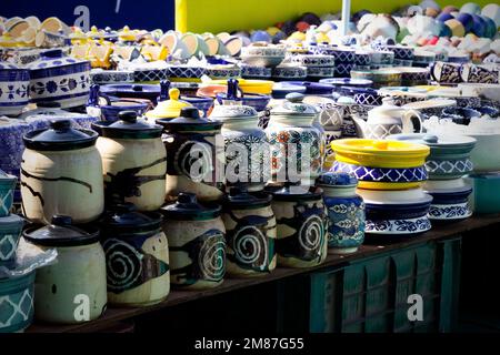 Beautiful colorful Asian decorated white blue art ceramic handmade pottery jars vessels cups mugs Stock Photo