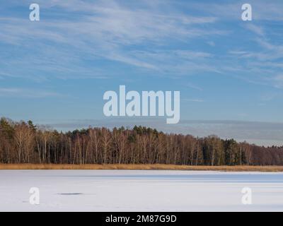 Frozen and snow-covered Echo Ponds in Roztocze National Park. Stock Photo