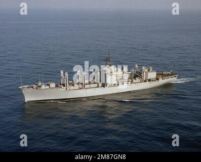 An aerial port bow view of the combat stores ship USS MARS (AFS-1) underway. Country: Pacific Ocean (POC) Stock Photo