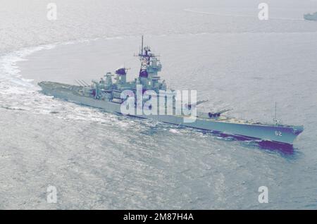 An elevated starboard bow view of the battleship USS NEW JERSEY (BB-62) underway. Country: Pacific Ocean (POC) Stock Photo