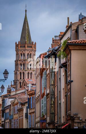 View on Saint Sernin Basilica bell tower from a street in Toulouse old town (South of France) Stock Photo